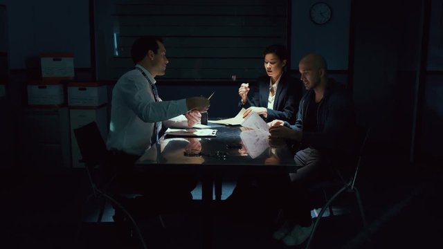  Crime suspect accompanied by lawyer in interview with police detective