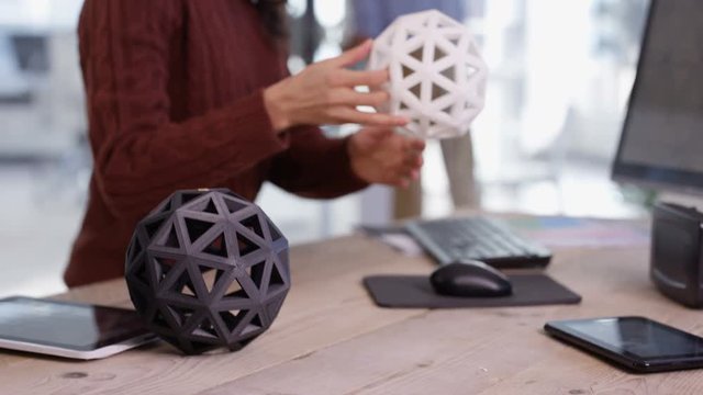  Creative design team working on a project with 3D printed objects