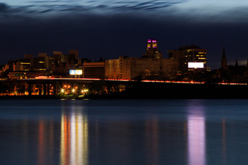Fototapeta na wymiar Night scene of urban Albany from Rensselaer docks across Hudson River
