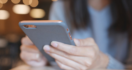 Using mobile phone in coffee shop