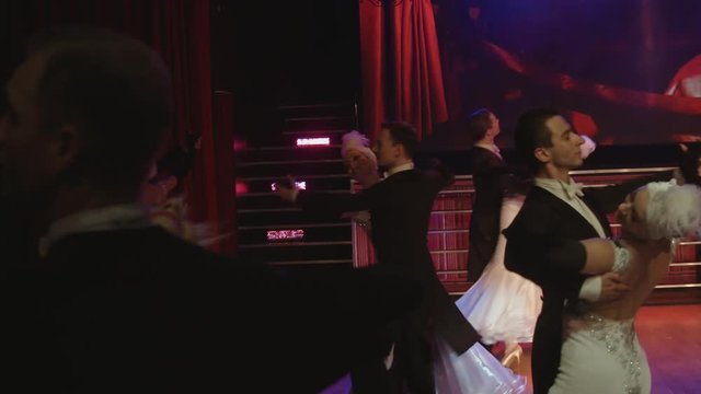 Couples are dancing waltz at stage