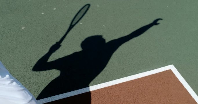  Shadow of tennis player jumping to hit the ball in super slow motion