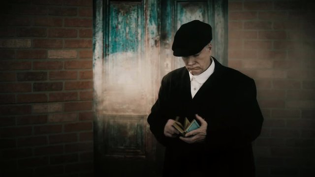 bookie or gambler from the 1920s walks in and checks his book