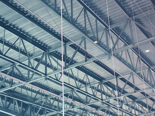 Big warehouse steel plate roof ceiling structure, with iron beams, perspective background, as shadow reflection from glass tile wall