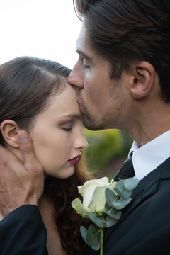 Groom Kissing On Bride Forehead