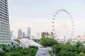Scenic view of highway and giant Ferris wheel in Singapore
