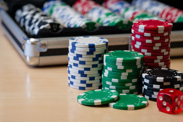 Stack of poker chips with it's container case