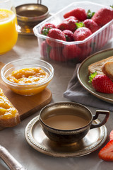 Traditional european breakfast. Bread, jam and berries