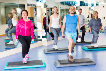 Fototapeta premium People do pilates with dumbbells