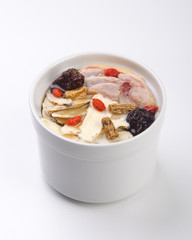Chicken and herb soup in pot, Chinese food style.