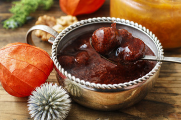 Bowl with strawberry jam.