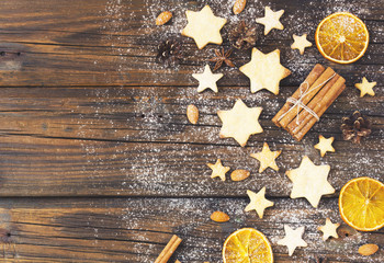 Christmas gingerbread cookies stars on a wooden table and coffe, selective focus