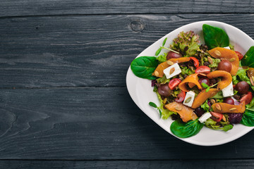 Pumpkin Salad. Healthy food. On a wooden surface. Top view. Free space for your text.