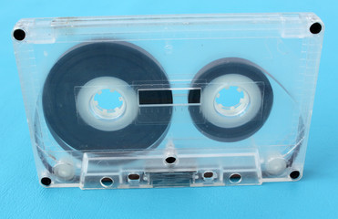 Old audio cassettes on a blue background