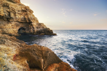 Cave in rock at the sea. Nature composition.