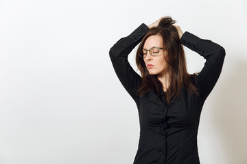 Beautiful European young sexy brown-haired woman in glasses for sight with healthy clean skin and charming smile, dressed in a dark black shirt enjoying on a white background. Emotions concept.