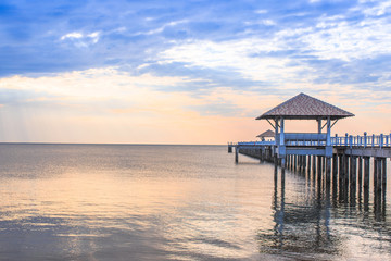 Old wood bridge pier  against beautiful sunset sky use for natural background ,backdrop and multipurpose sea scene