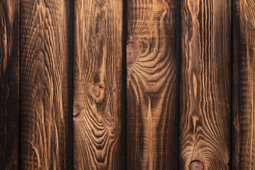 Texture of boards of dark old brown wood