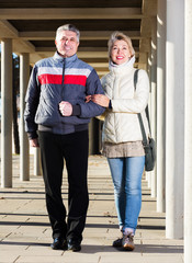 Mature couple walking outdoors
