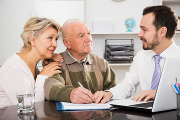 Old man and woman in social department