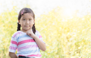 cute asian little girl thinking
