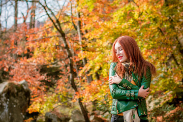 Woman in wild nature for blessing and enjoying nature greatness. Relaxation, meditation, harmony of inner life and mind. Unity of human and world. Exaltation of heart and consciousness.