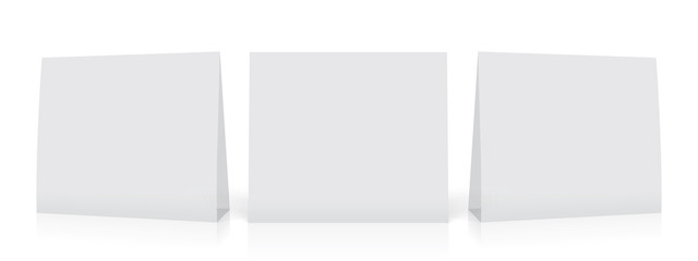 A white paper  calendar stands on the table. Mock Up Vector Template