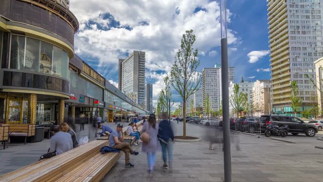 Walk on New Arbat Avenue timelapse hyperlapse popular tourist street in Moscow with shops and cafe in sunny summer day. Famous landmarks houses as books.