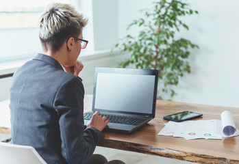 Businesswoman working on a laptop 