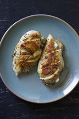 Chicken fillet laying around on a white background