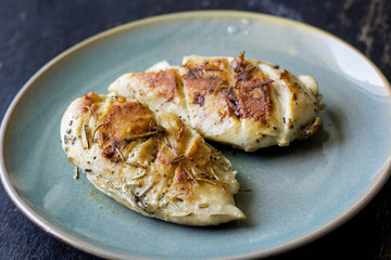 Chicken fillet laying around on a white background