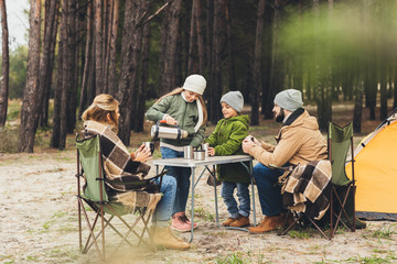 family camping together - obrazy, fototapety, plakaty