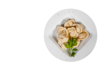 Meat dumplings - russian pelmeni, ravioli with meat. with copy space. top view. isolated on white