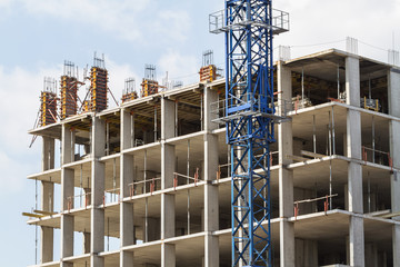 Building under construction and tower crane