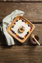 Fototapeta na wymiar Fruit yogurt and honey on a wooden table