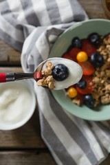 Yogurt and blueberry in a spoon