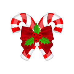 Traditional Christmas candy with bow and holly on white backgrou