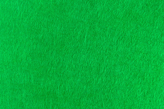 Green felt natural texture for background.
