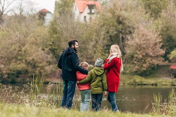 young family near lake