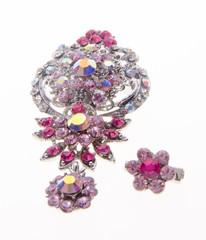 brooch with different gems on background.