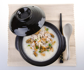 Traditional chinese pork porridge rice gruel served in claypot
