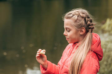 child eating in park