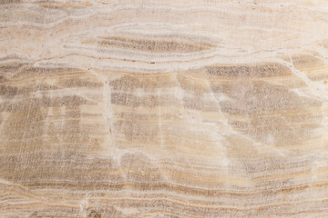 Lightened slices marble onyx. Horizontal image. Warm calm colors. Beautiful close up background, onyx marble texture.