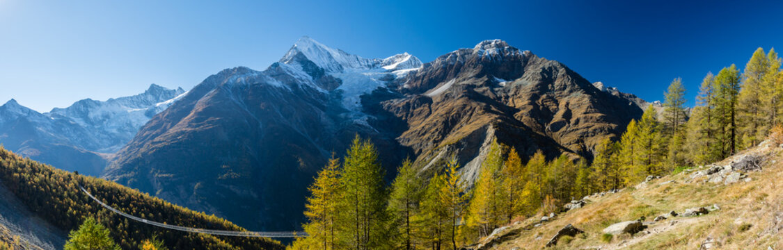 Panoramic view on Charles Kuonen suspension bridge in Swiss Alps, the longest suspension bridge in the world