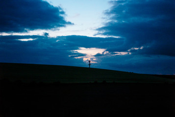 A twilight sky over a rural radio tower.