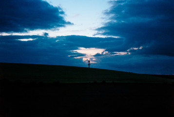 Naklejka na ściany i meble A twilight sky over a rural radio tower.