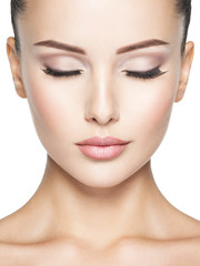 Beautiful and calm face of young woman with  health skin