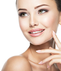 Beautiful face of young cheerful woman with  health fresh skin