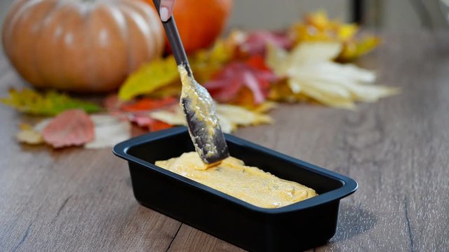 A woman in the kitchen to cook pumpkin bread