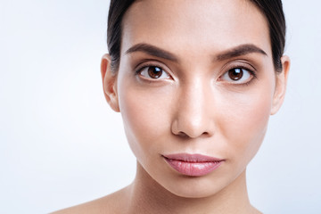 Obraz premium Close up of beautiful dark-haired dark-eyed woman